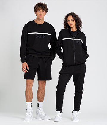 MALE AND FEMALE MODEL WEARING TRACK COLLECTION IN BLACK