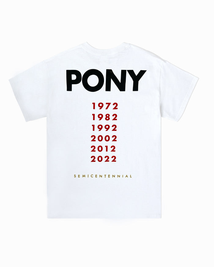 PONY White Semicentennial sports tee back shot showing the Semicentennial back design. PONY word mark logo across the back of the t-shirt. PONY Semicentennial years featured in red printed in a vertical format. Years "1972, 1982, 1992, 2002, 2012, and 2022" featured. SEMICETENNIAL embroidered in all capitals below, across the lower bottom of shirt.