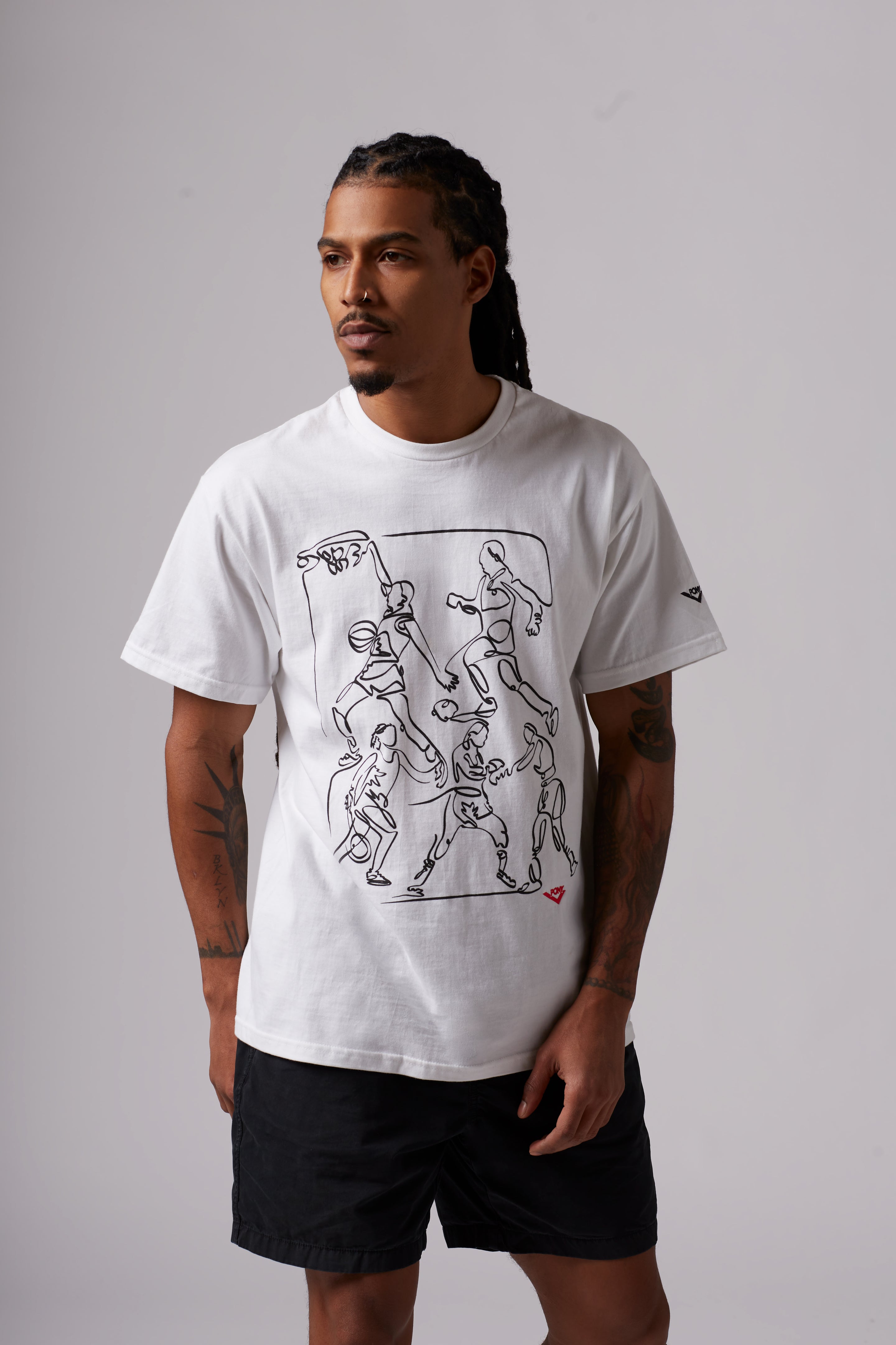 A male model wearing the PONY semicentennial sports tee in white. T-shirt features a figurative style line drawing of basketball players and an embroidered red pony lockup logo at the bottom right.