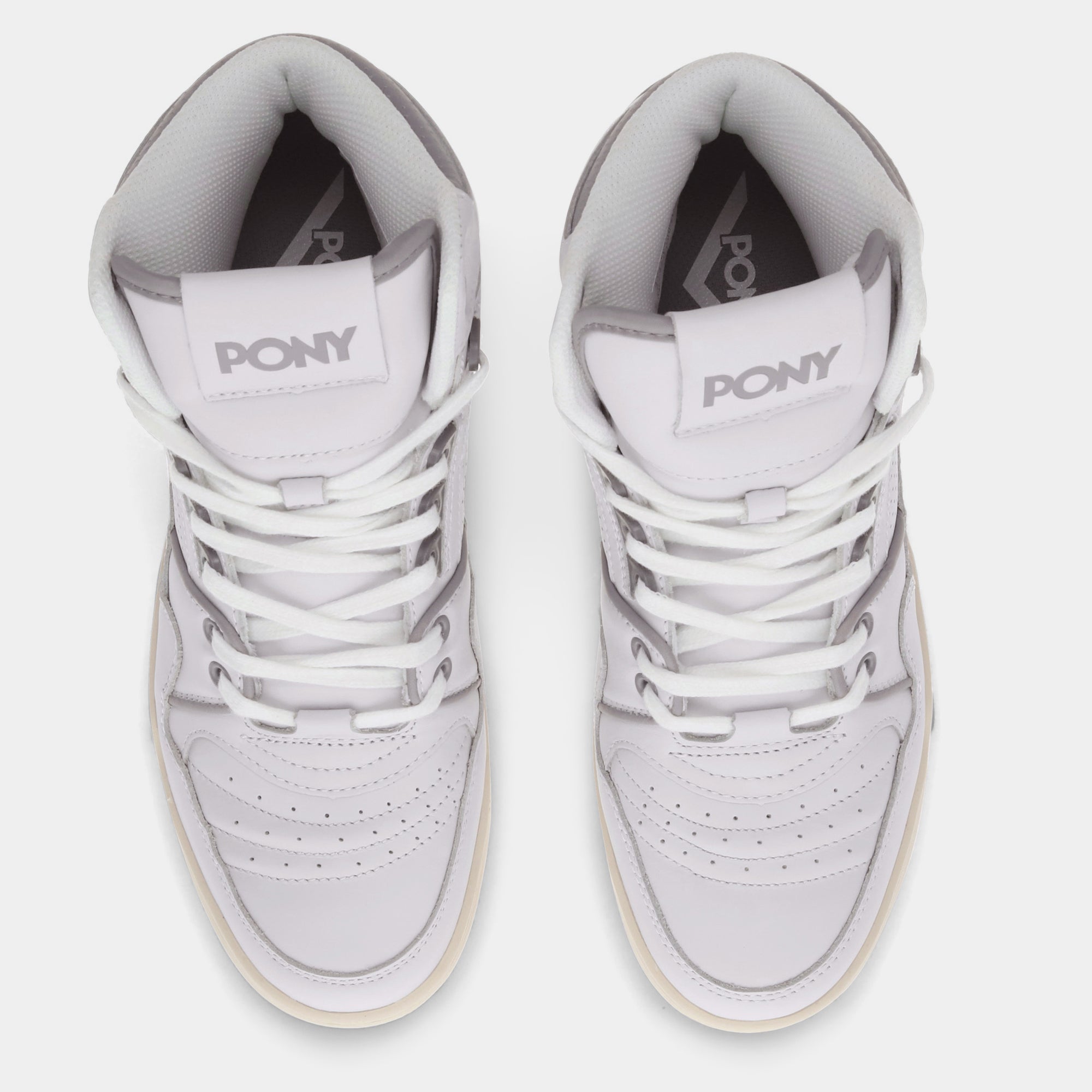 Overhead view of PONY High top shoes featuring the O+PONY wordmark on both tongues and PONY stamp on inner sole.