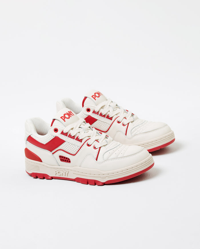 Image of a 3/4 shot of the Red M-100 PONY sneaker featuring a white body and red accents. PONY Wordmark visible on outer sole of shoe and RED PONY logo on tongue.